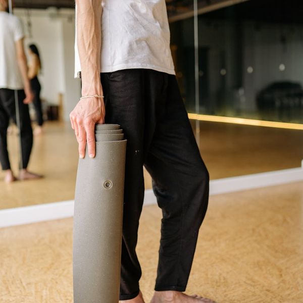 Person holding a challenging yoga pose, showing strength and balance.